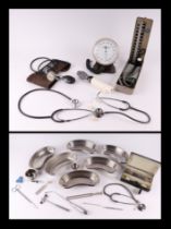 A quantity of vintage medical instruments to include a stethoscope, reflex hammers and blood