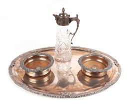 A pair of silver plated wine coasters; together with a silver plate mounted claret jug with