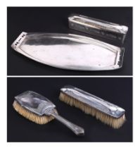 A Secessionist design silver plated four-piece dressing table set to include tray, brushes and