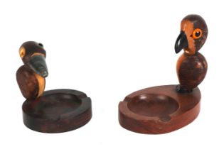 An Art Deco YZ nut and cherry amber Bakelite ashtray; together with another similar (2). Condition