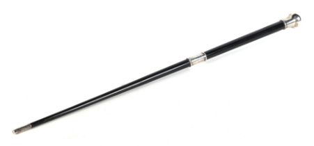 A silver mounted ebonised presentation conductor's baton with presentation inscription 'Presented to