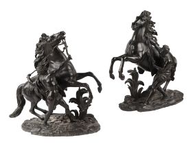 After Guillaume Coustou - a pair of French bronze Marley horse groups, each bear Coustou