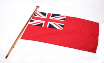 An original cotton Naval Red Ensign flag with hardwood flag pole. The Ensign is 70cms (27.5ins) by