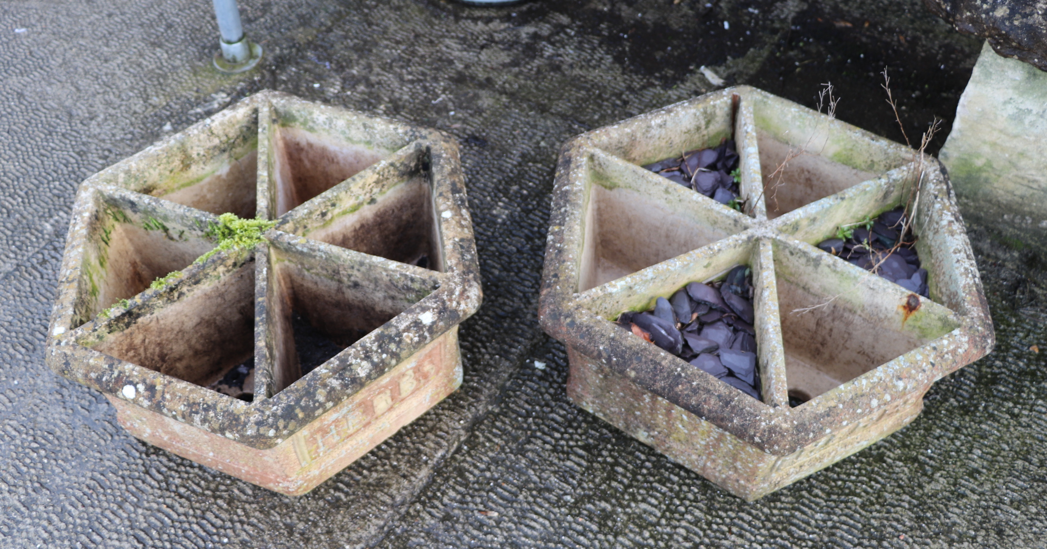A pair of hexagonal sectioned stoneware herb planters, 61cm wide (2).