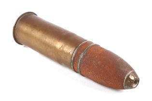 A complete inert WWI artillery shell and brass casing in three parts. Date stamp to the base for 2.