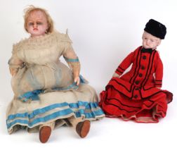A Victorian wax headed doll with blue glass eyes, wax forearms and legs, approximately 50cm high;