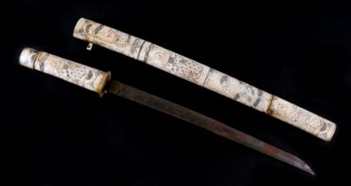 A late 19th / early 20th century Japanese carved bone short sword or Wakizashi carved throughout