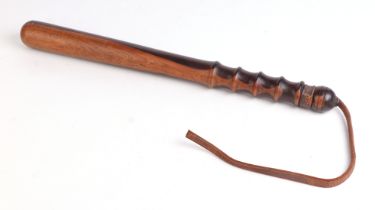 A lignum vitae truncheon, 40cms long.