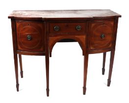 A George III mahogany breakfront sideboard of small proportions, the central door flanking two