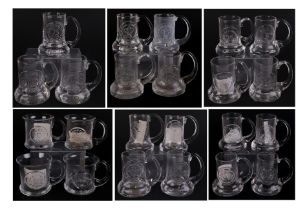 A quantity of Dartington glass commemorative Christmas mugs.