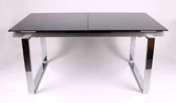 A modern Italian design glass and chrome extending dining table xxx size