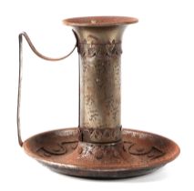 An Arts and Crafts style chamberstick of large proportions, with planished decoration, 20cm high.