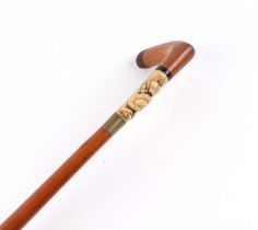 A 19th century bamboo walking stick, with carved marine ivory section, depicting an Eastern