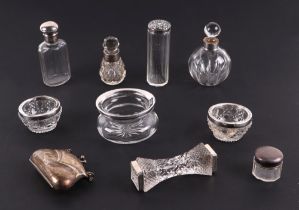 A group of silver topped scent bottles and dressing table jars, a silver purse and other silver