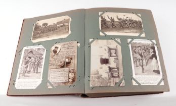A military interest postcard album, containing numerous late Victorian and WWI and later
