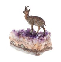 A cold painted bronze Chamois mounted on an amethyst crystal base, 12cms wide. Condition Report Some