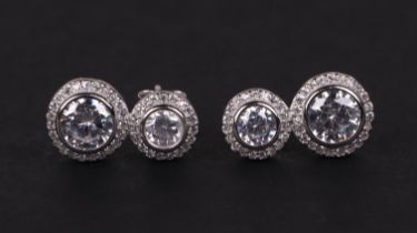 A pair of silver double drop cubic zirconia halo earrings