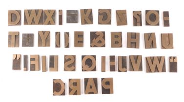 A full alphabet of brass printing blocks.