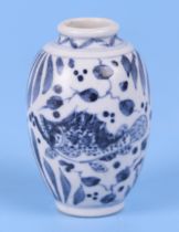 A small Chinese blue and white vase, decorated with fish, 7cm high.