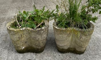 A pair of well weathered stoneware garden lobed form planters, 34cm diameter (2).