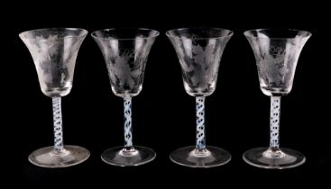 A set of four etched wine glasses, with air twist stems, 18cm high (4)