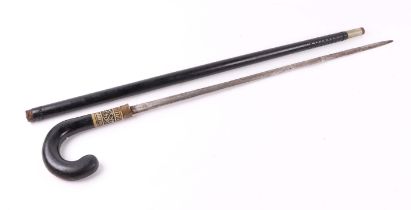 An early 20th century Indian ebonised sword stick, 92cm long, blade length 65cm.