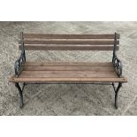 A garden bench with cast bench ends, 120cm wide.