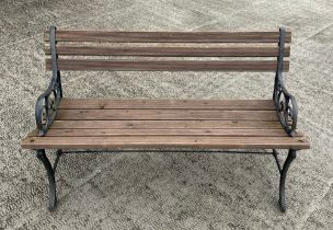 A garden bench with cast bench ends, 120cm wide.