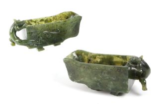 A pair of Chinese carved nephrite Libation cups with dragon handles, each 16cm wide (2). Condition