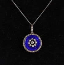A 19th century diamond set and blue enamel pendant, on a fine white metal chain, 23mm diameter,