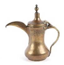 A Turkish / Islamic brass dallah coffee pot, 20cm high.