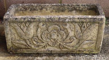 A well weathered stoneware rectangular form garden planter, 61cm wide.