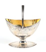 A George III silver gilt swing handled sugar basket, London 1791 and markers mark for Benjamin