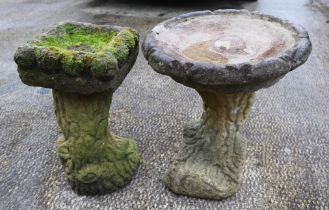 Two well weathered stoneware bird baths, largest 43cm high (2).