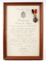 A framed and glazed Belgian Medal with Certificate. The frame is 27.5cms (10.75ins) by 40.5cms (