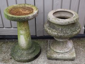 Two well weathered stoneware birdbaths, largest 49cm high (2).