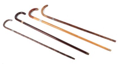 A group of walking sticks, with silver and gold plated mounts, (4).