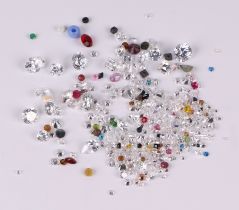 A quantity of loose and unmounted cubic zirconia, mixed gemstones and beads.