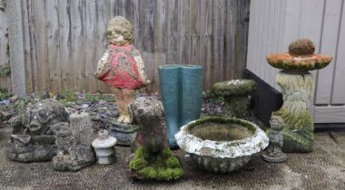 A group of well weathered garden ornaments, to include a group of pigs and a small bird bath (10).