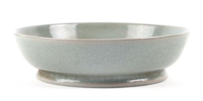 A Chinese crackleware celadon glaze shallow bowl, 14.5 cm diameter.