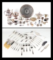 A group of silver plated item, to included a tray, teapot, trophy cups, toast rack and other similar