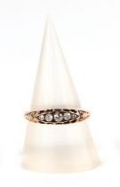An 18ct gold five stone diamond ring, approx UK size N, 3.2g.