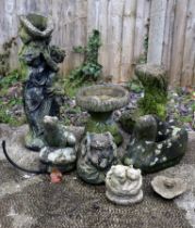 A group of well weathered stoneware garden ornaments, to include a water feature and small bird