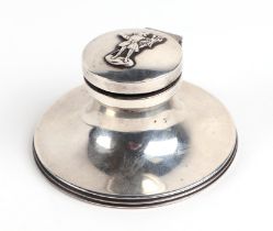 An early 20th century silver capstan, silver inkwell, Birmingham 1915, the top decorated "The Trusty