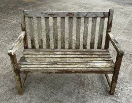 A slatted wooden garden bench, 124cm wide.