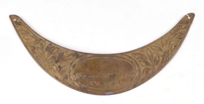 A WWI Adrian helmet brass plaque to show that the soldier served in the Great War. Overall width