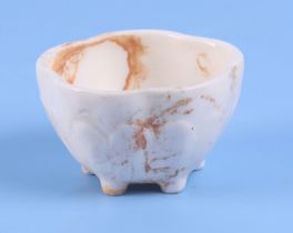 A Chinese blanc de chine lotus flower bowl, standing on five feet, 8cm diameter.