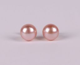 A pair of 9ct gold stud earrings, set with a oblate spheroid pink cultured pearls, boxed.