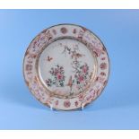 An 18th century Chinese famille rose plate decorated with birds, insects and flowers, 23cm diameter,