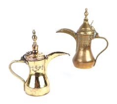 A Turkish / Islamic brass dallah coffee pot, 24cms high; together with another similar, 22cms